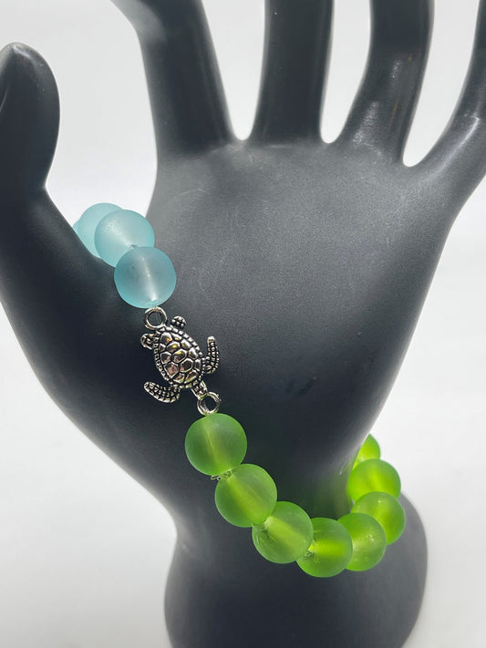 Sea turtle with green and blue sea glass bracelet