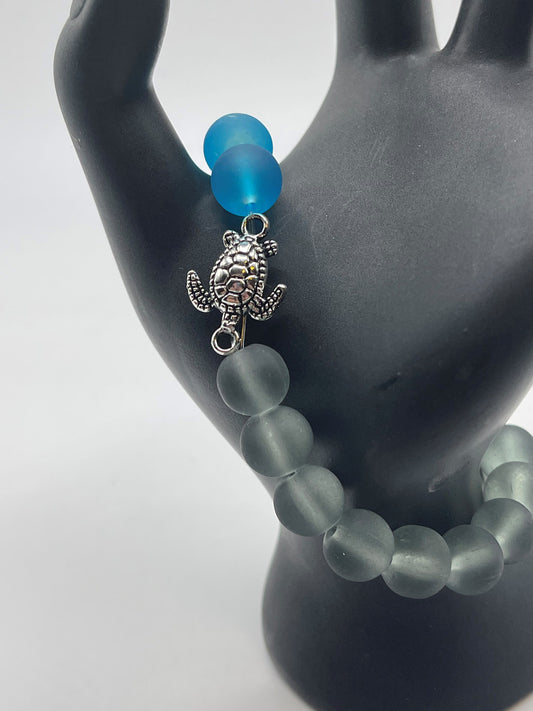 Sea turtle with grey and blue sea glass bracelet