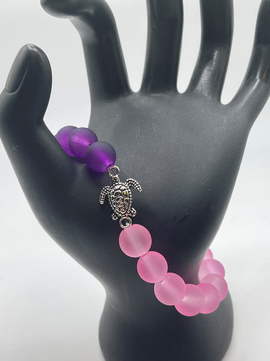 Sea turtle with pink and purple sea glass bracelet